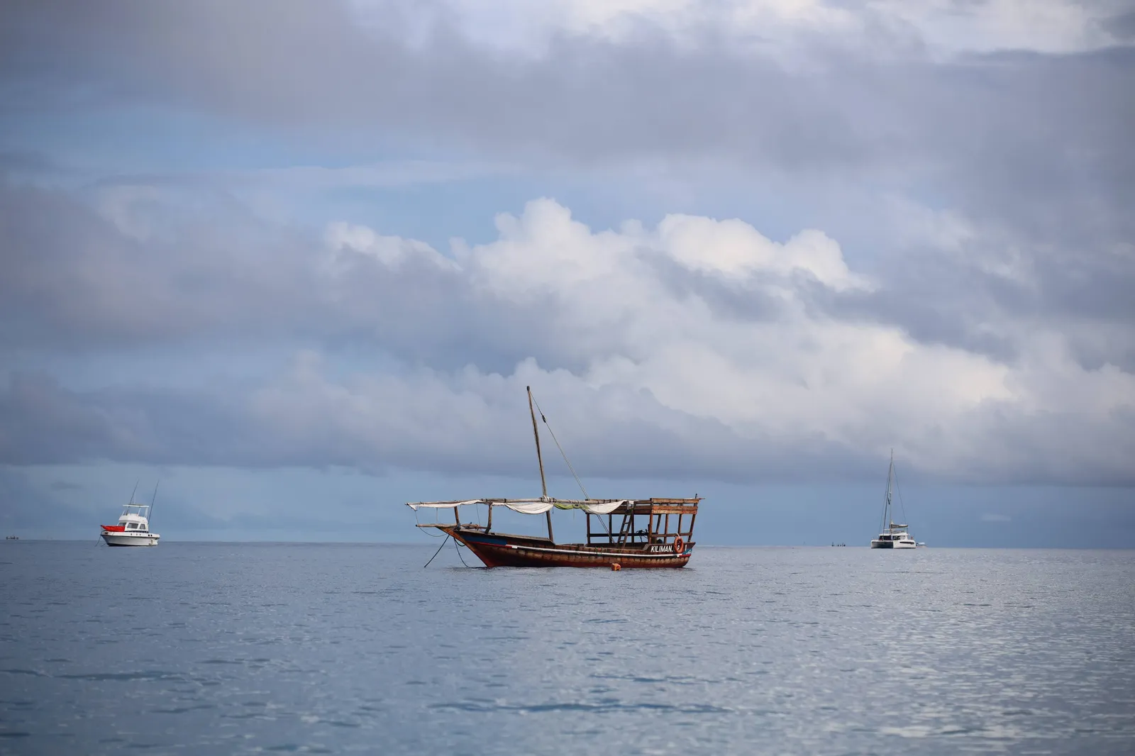 A traditional dhow under sail off the Zanzibar coast