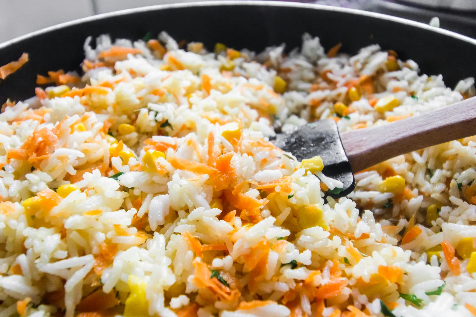 Spiced pilau rice in a black pan